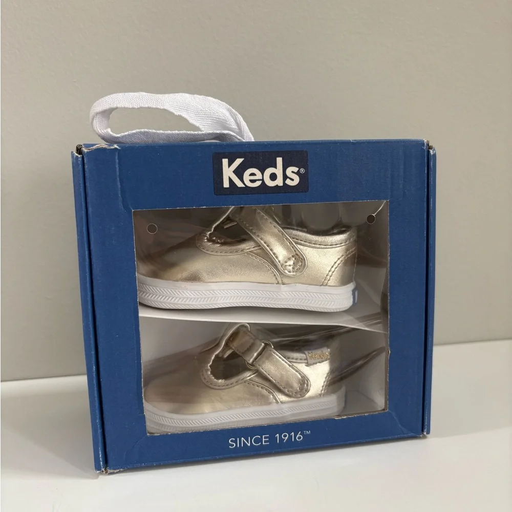 Keds Infant Champion Lace Toe Cap T-Strap Sneaker in Champagne Metallic